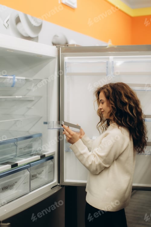 Preview: Woman Shopping for a New Refrigerator at an Electronics Store