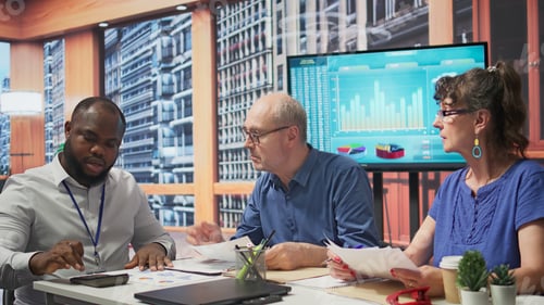 Preview: Senior woman reads the new retirement plan contract in a meeting with broker