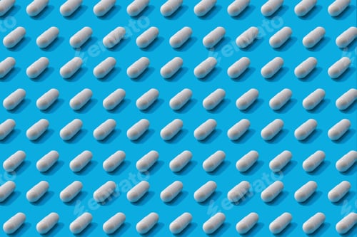Preview: Trendy pattern made with white Pharmaceutical medicine pills, tablets or capsules on blue background