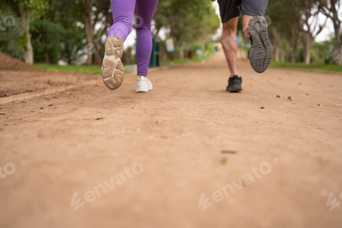 Preview: Couple jogging, in the park.