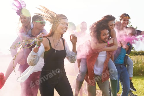 Preview: Group Of Friends Walking Back To Tent After Outdoor Music Festival With Balloons And Smoke Flare
