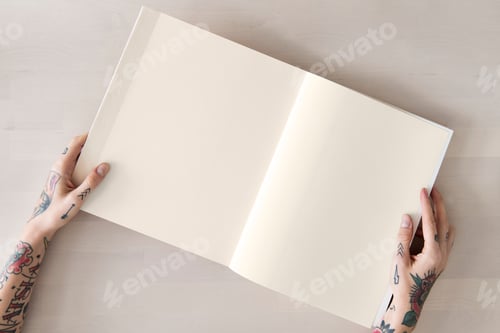 Preview: Tattooed woman reading a book