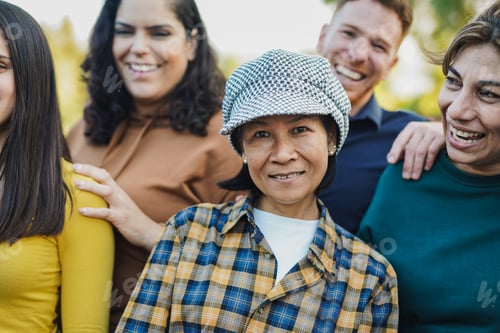 Preview: Multigenerational people having fun together outdoor - Multiracial friendship and community concept