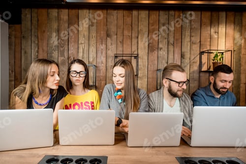 Preview: People working together with laptops