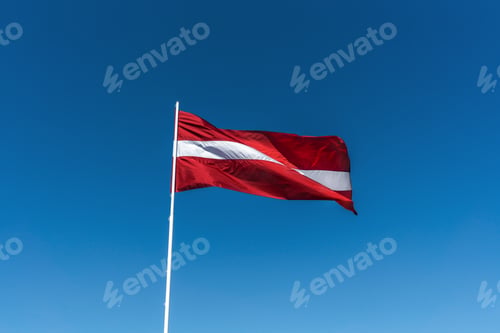 Preview: Latvian National Flag with a blue sky - Latvia