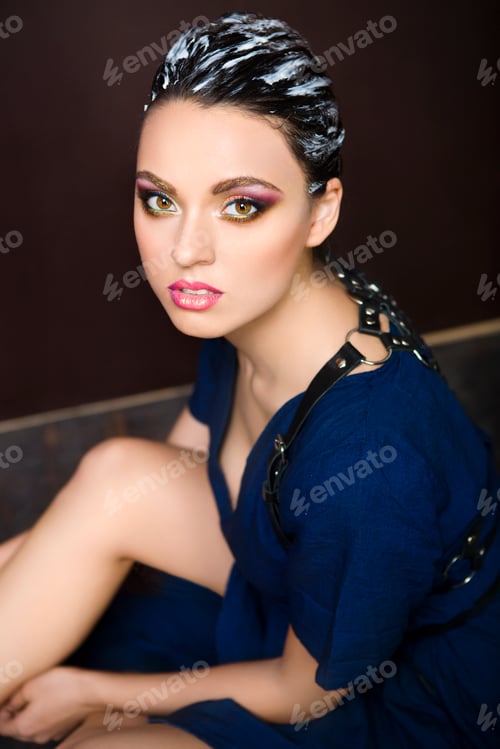 Preview: Beautiful young brunette woman with fantasy makeup and hair dress