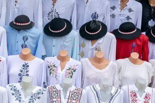 Preview: Display of Embroidered Clothing on Mannequins in Shop