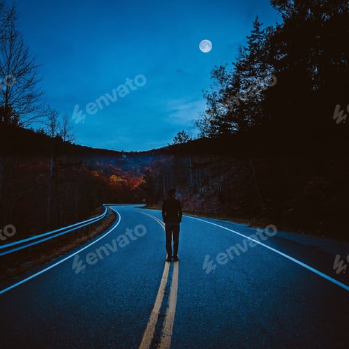 Preview: Man on mountain road at sunset looking at the moon.