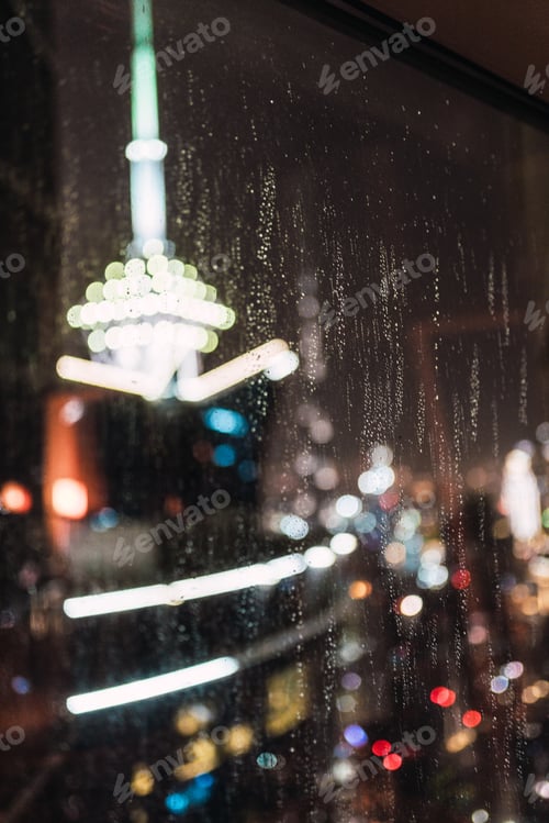 Preview: Night city through wet glass