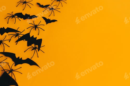Preview: Happy Halloween. Spiders and bats layout on orange background with space for text. Greeting card
