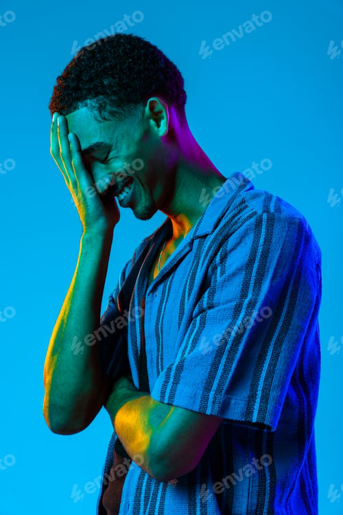 Preview: African man portrait in studio on colorful background