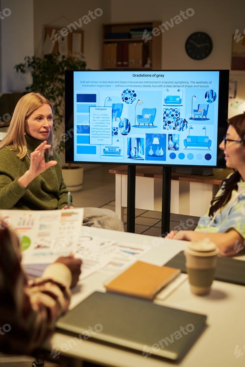 Preview: Young Woman Leading Creative Team Meeting Discussing Design Concepts
