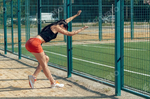 Preview: Beautiful Girl Sportswoman Exercising On A Sunny Morning At The Stadium