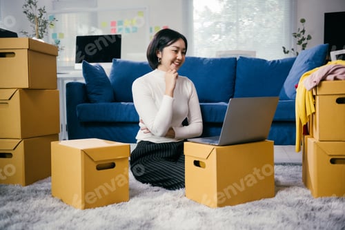 Preview: Online seller checking inventory and planning sales strategy using laptop