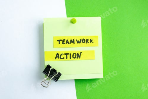 Preview: Top view of TEAMWORK ACTION writing on sheet on white green mix colors background with free space