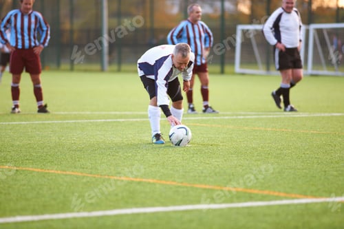Preview: Football player positioning ball