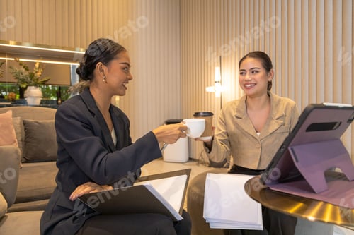 Preview: Business friends working together, talking, drinking coffee