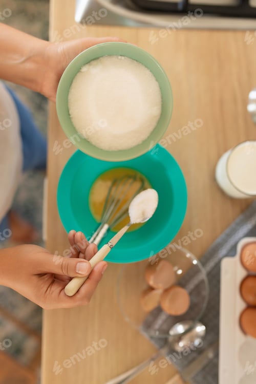 Preview: the cooking process, the woman adds ingredients to the pancake batter