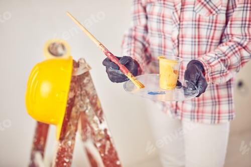 Preview: Working Woman Plastering / Painting Walls Inside The House.