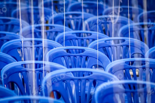 Empty blue plastic chairs