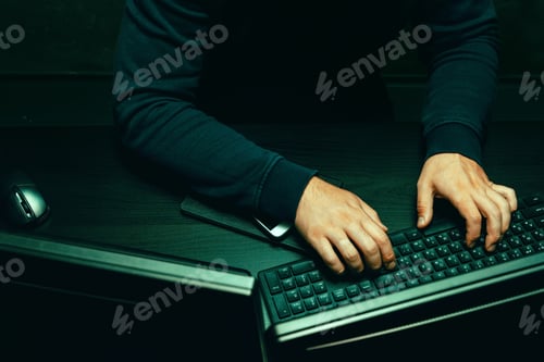 Preview: Close up of programmer of hacker hands typing a code