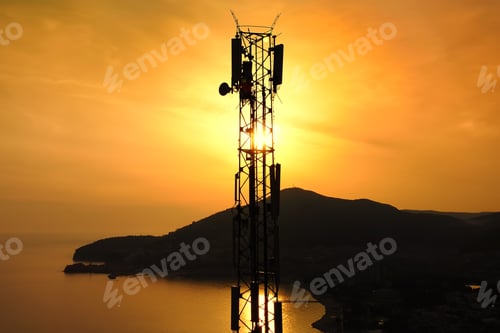 Preview: Amazing closeup sunset drone view of silhouette of cell tower