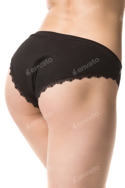 Preview: girl in black lace panties, back view, half-length shot on a white background