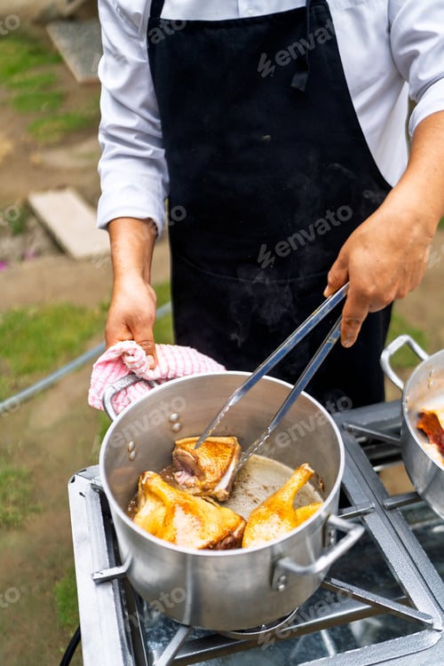 Preview: Chef preparing food outdoors for country restaurant