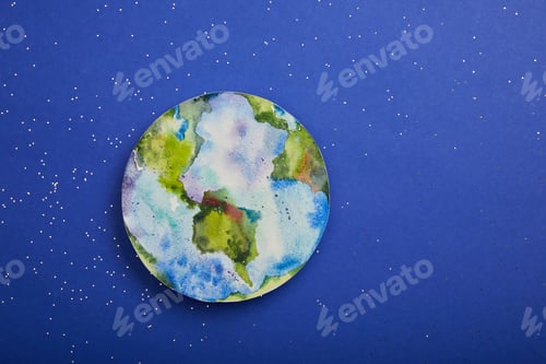 Preview: top view of planet picture on violet background with stars, earth day concept