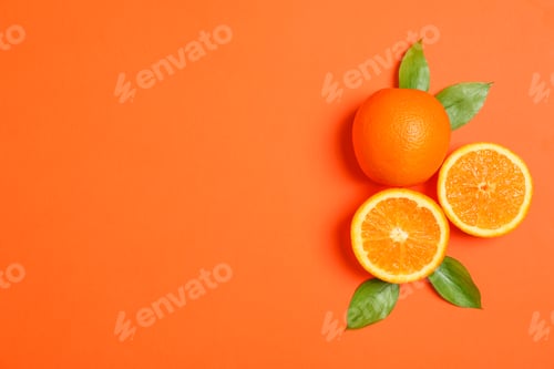 Preview: Ripe oranges and leaves on color background. Space for text