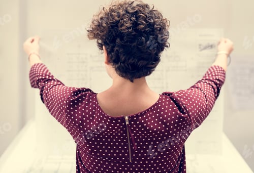 Preview: Woman working on a plan