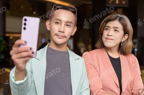 Preview: Transgender and non-binary coworkers working remotely in cafe