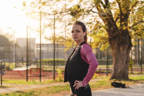 Preview: Fit Caucasian woman working out outdoors.