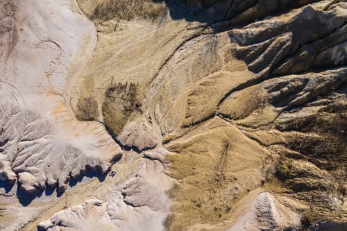 Preview: Surrealistic aerial image of abandoned opencast mine. Bad land pattern from a drone