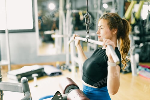 Preview: woman arms shoulder core muscle strength workout training lat pull down in fitness sport club