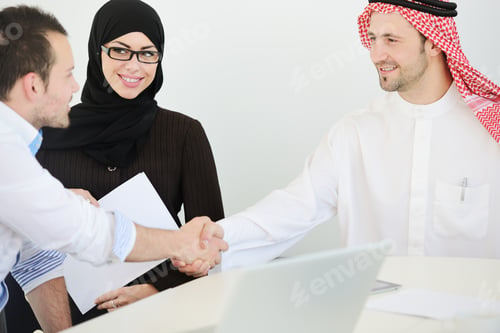 Preview: Group Of Multi Ethnic Business People Dealing A Contract And Hand Shaking