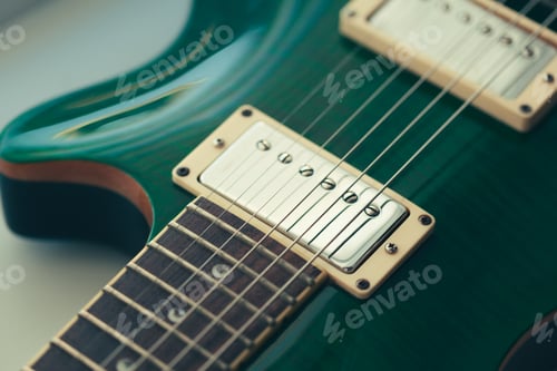 Preview: Electric guitar body and neck detail on wooden background