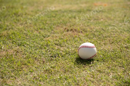 Preview: Baseball ball seen laying on grass