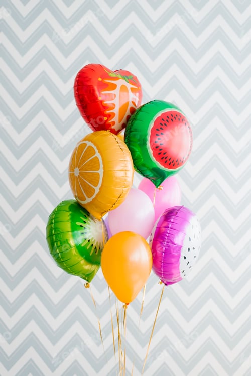 Preview: Colorful Fruit And Heart Balloons Against Zigzag Wall
