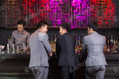 Preview: Young friends chatting at bar