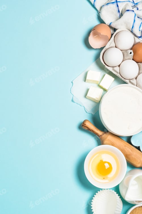 Preview: Baking ingredients at blue table top view.