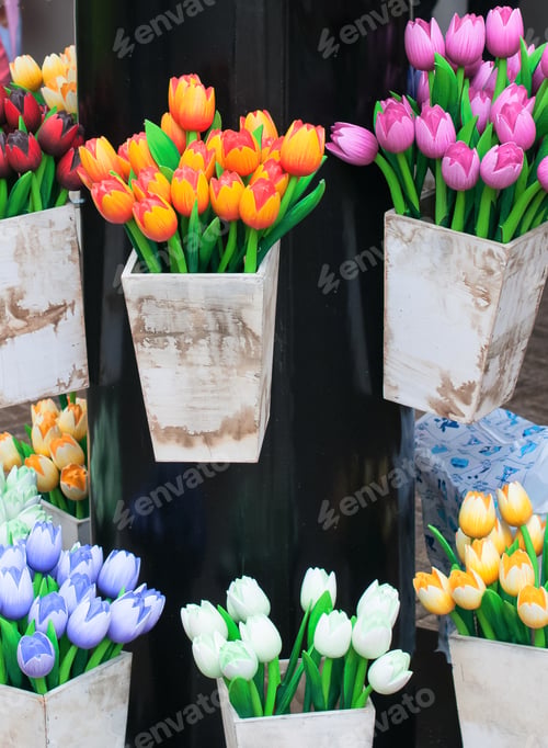 Preview: Bright wooden tulips flowers in boxes for decoration. Selective focus. Spring or summer concept.