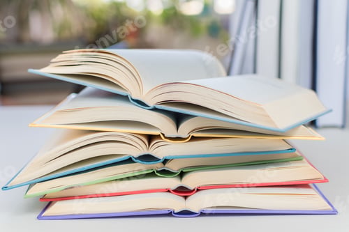 Preview: Closeup shot of the open textbooks on the desk