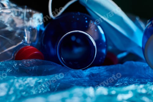 Preview: Piled plastic waste on a black background. Concept of pollution and environment