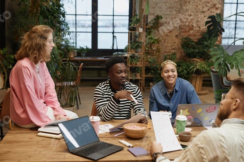 Preview: Diverse Successful Business Team Working at Meeting Table