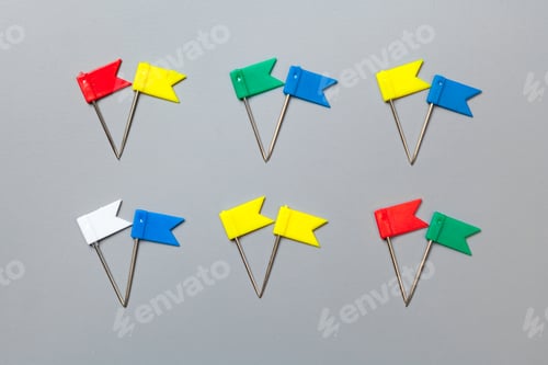 Preview: Colorful push pins isolate on gray background