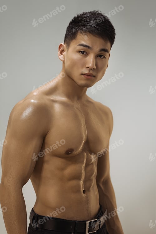 Preview: Muscular Asian Man Indoors in the Studio