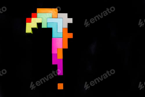 Preview: question mark wooden blocks on black background. Geometric shapes in different colors.