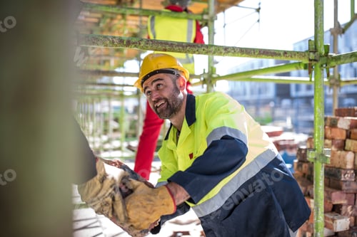 Preview: Construction workers moving bricks