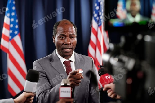 Preview: Focus on mature male politician pointing at one of journalists during interview